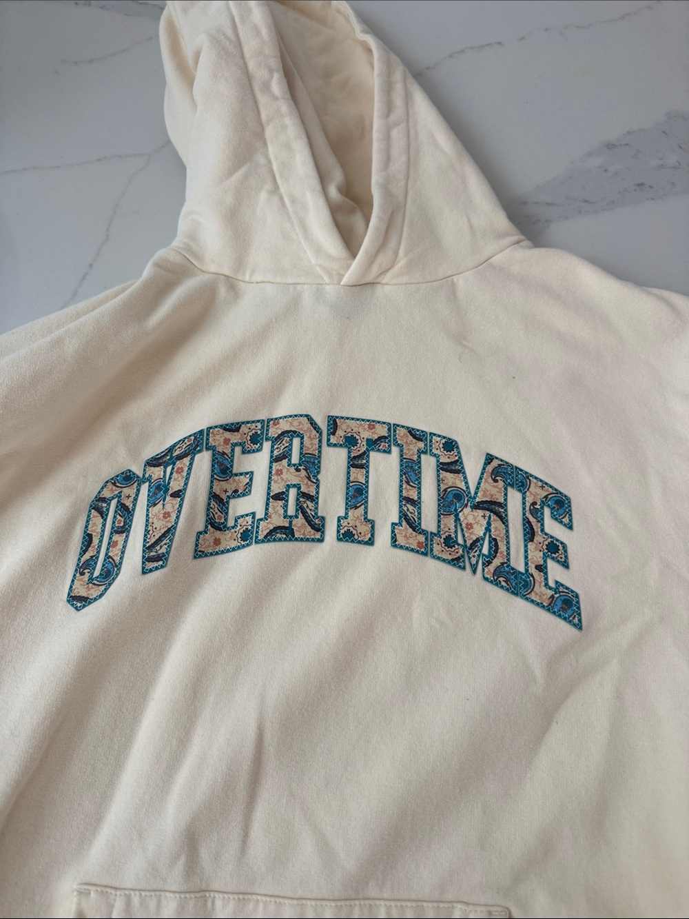 Cream Hoodie with Teal Paisley Overtime Arch Print